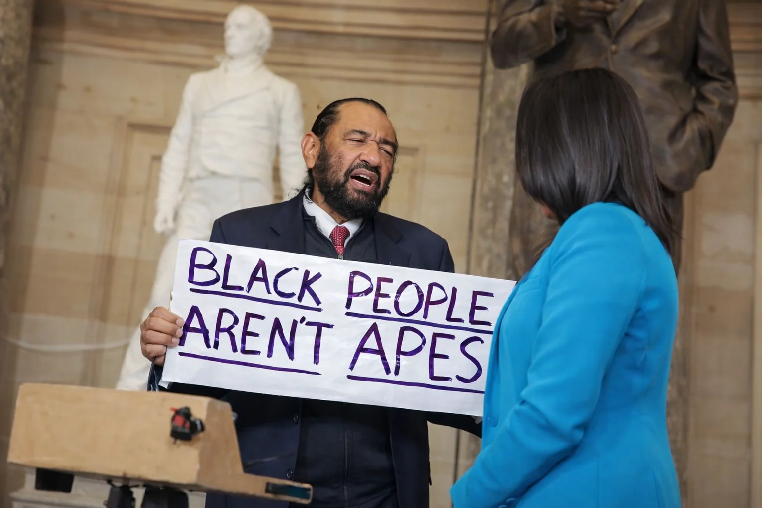 Al Green being escorted out after holding protest sign during Trump’s State of the Union